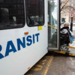 woman in wheelchair boarding Winnipeg bus via handi-transit ramp